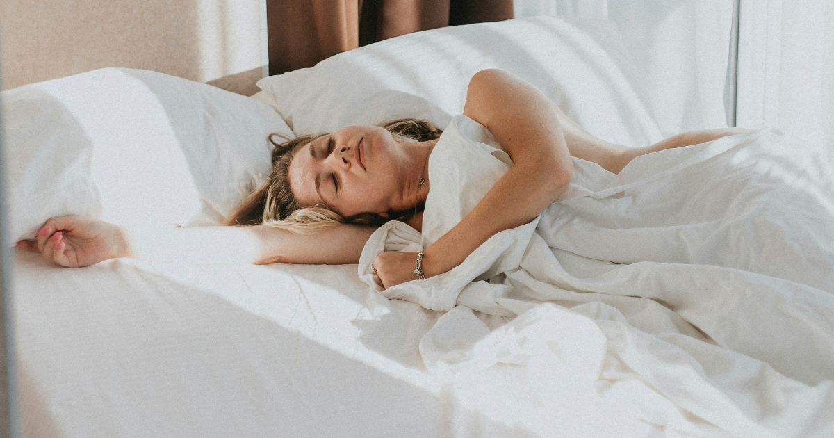Woman in bed. Tubal Reversal Recovery.